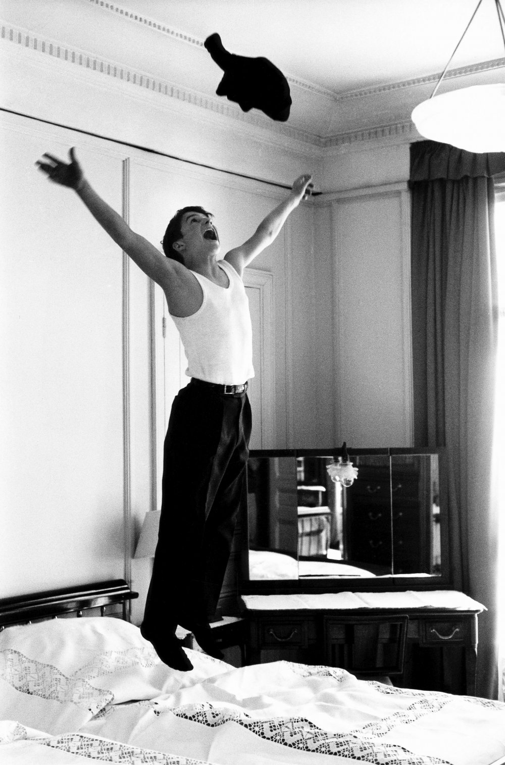 A 15-year-old Jean-Pierre Léaud jumps on his bed in his hotel room in 1959. The 400 Blows premiered at Cannes that year.