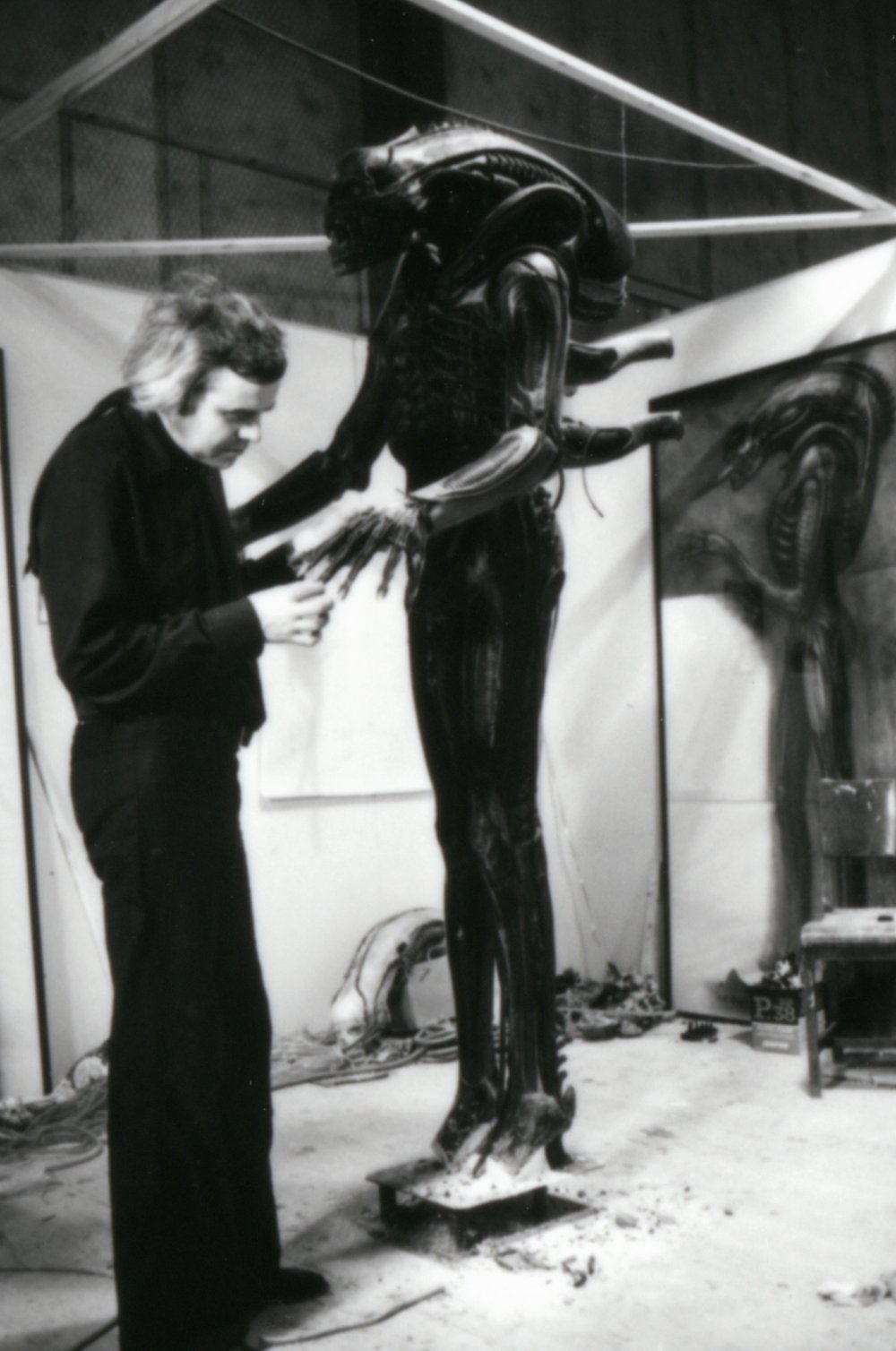 H.R. Giger prepares the model for Alien (1979)