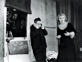 Director Alfred Hitchcock on set with lead actress Anny Ondra directing the now better-known sound version of Blackmail
