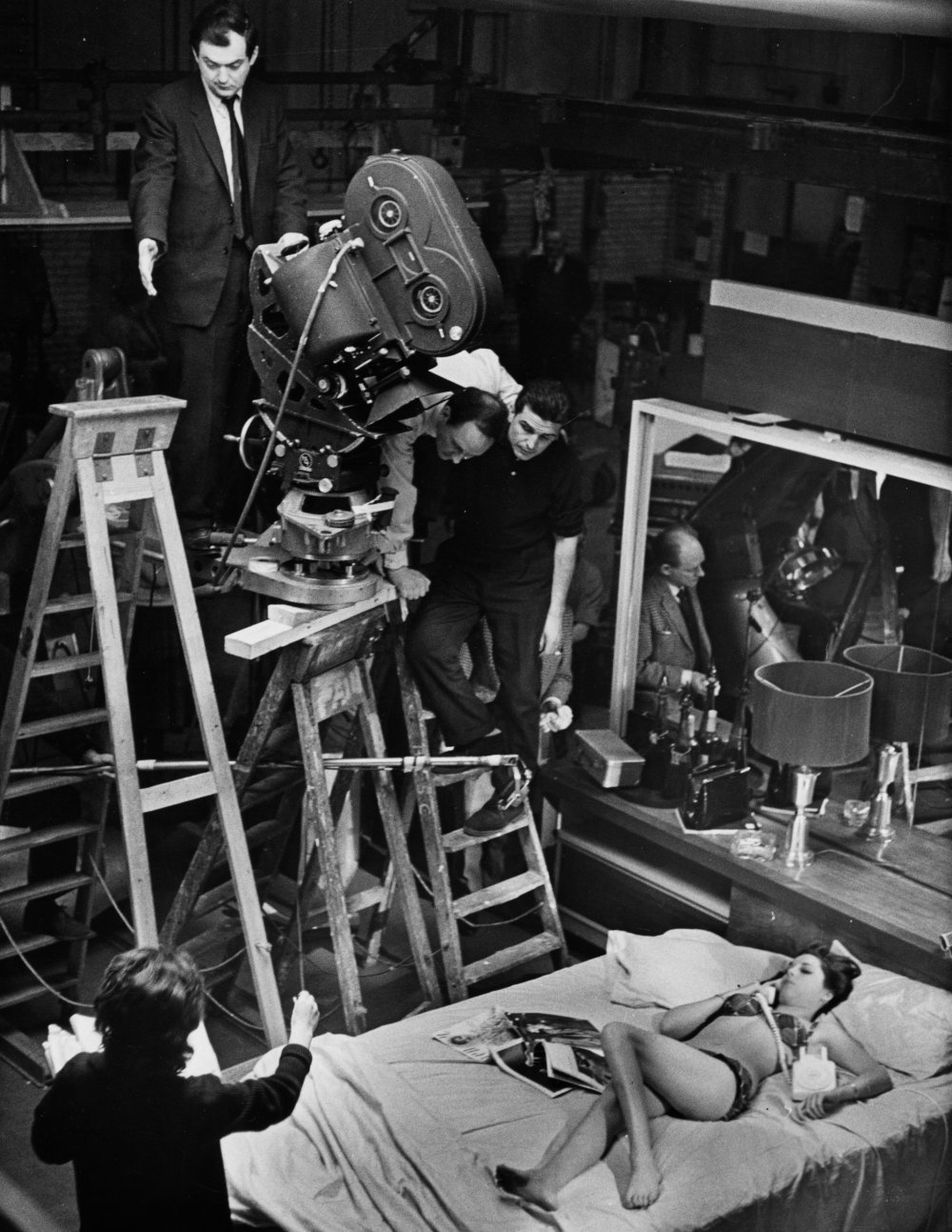 Framing a high-angle shot of Tracy Reed (playing Miss Scott) in Turgidson&amp;#8217;s bed.
