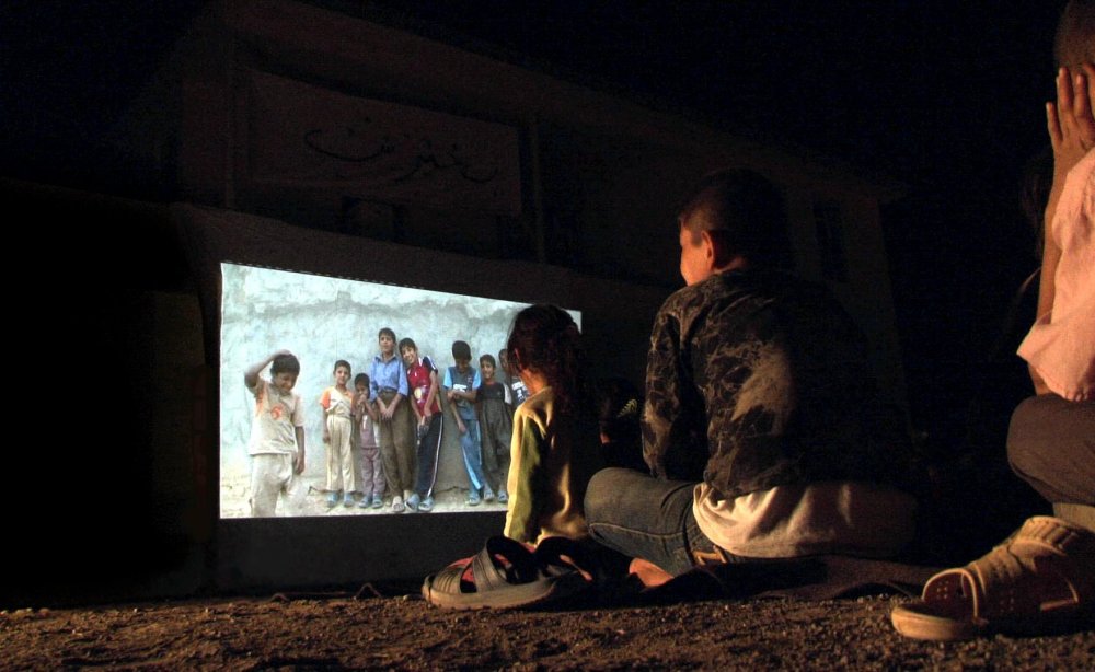 Kids in Goptapa watching themselves on screen