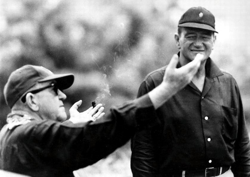 John Ford (left) directing John Wayne on the set of Flashing Spikes (1962)