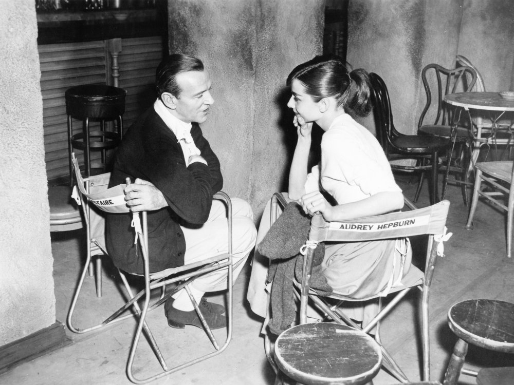 Astaire and Hepburn chat on the set for a boho Parisian caf&amp;eacute;