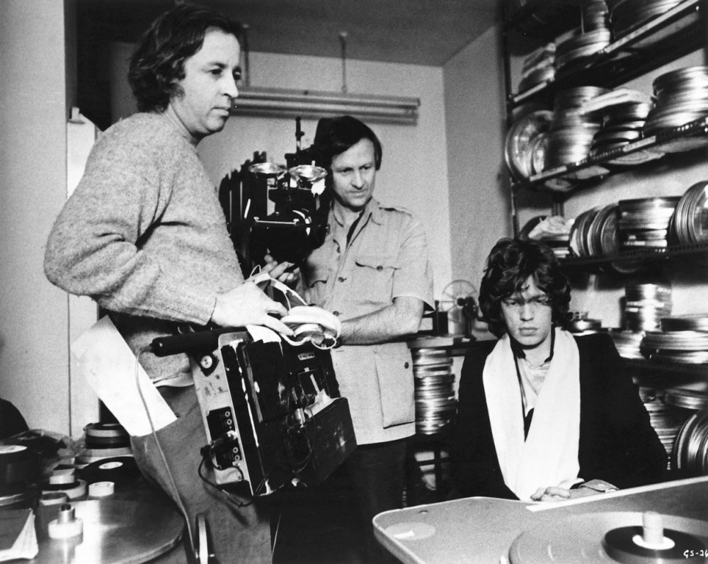 Albert (centre) and David Maysles with Mick Jagger looking at footage in Gimme Shelter (1970)
