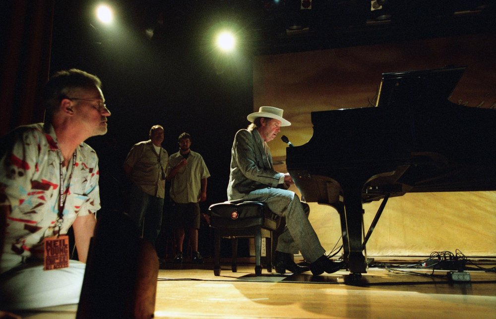 Demme watching Neil Young perform for their concert documentary Neil Young: Heart of Gold (2006)