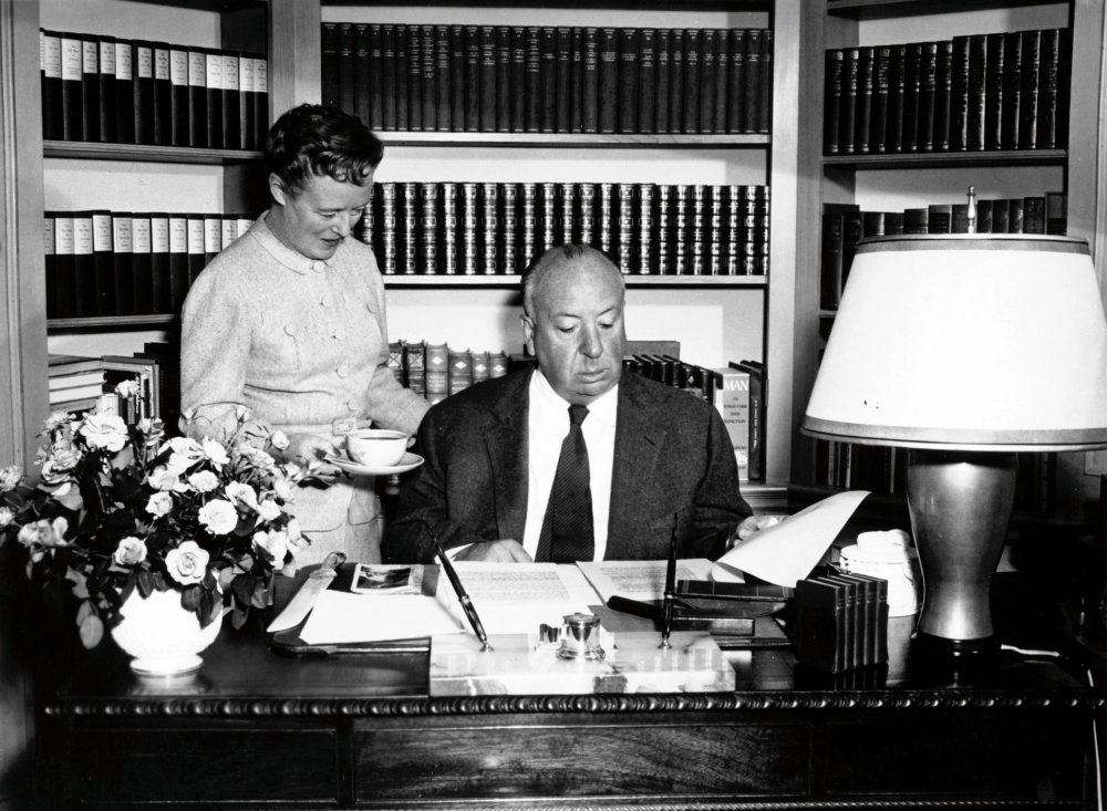 Alfred Hitchcock at study (with his wife Alma Reville)