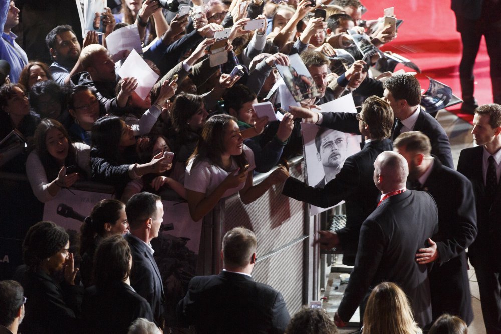 Brad Pitt mingles with the ecstatic crowd at the Closing Night Gala screening of Fury