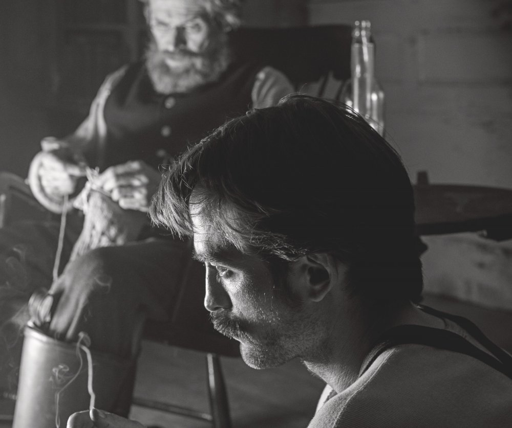 Willem Dafoe as the lighthouse-keeper and Robert Pattinson as his second in The Lighthouse