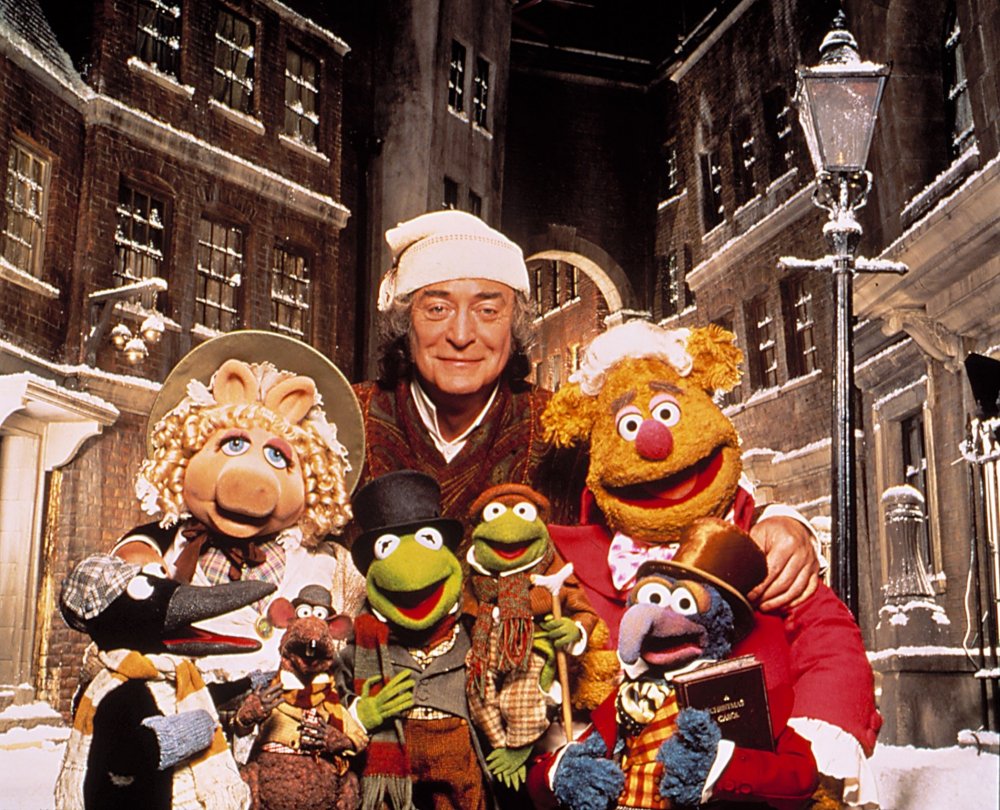 Michael Caine as Ebenezer Scrooge with his fellow cast members of A Muppet Christmas Carol (1992)