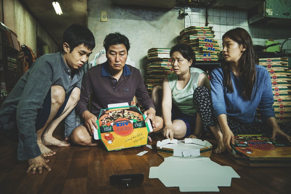 Choi Woo-shik as Ki-woo, Song Kang-ho as Ki-taek, Chang Hyae-jin as Chung-sook and Park So-dam as Ki-Jung in Parasite (Gisaengchung)