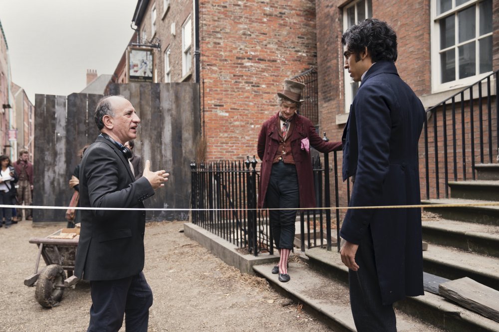 Iannucci directing Peter Capaldi (as Mr Micawber) and Patel