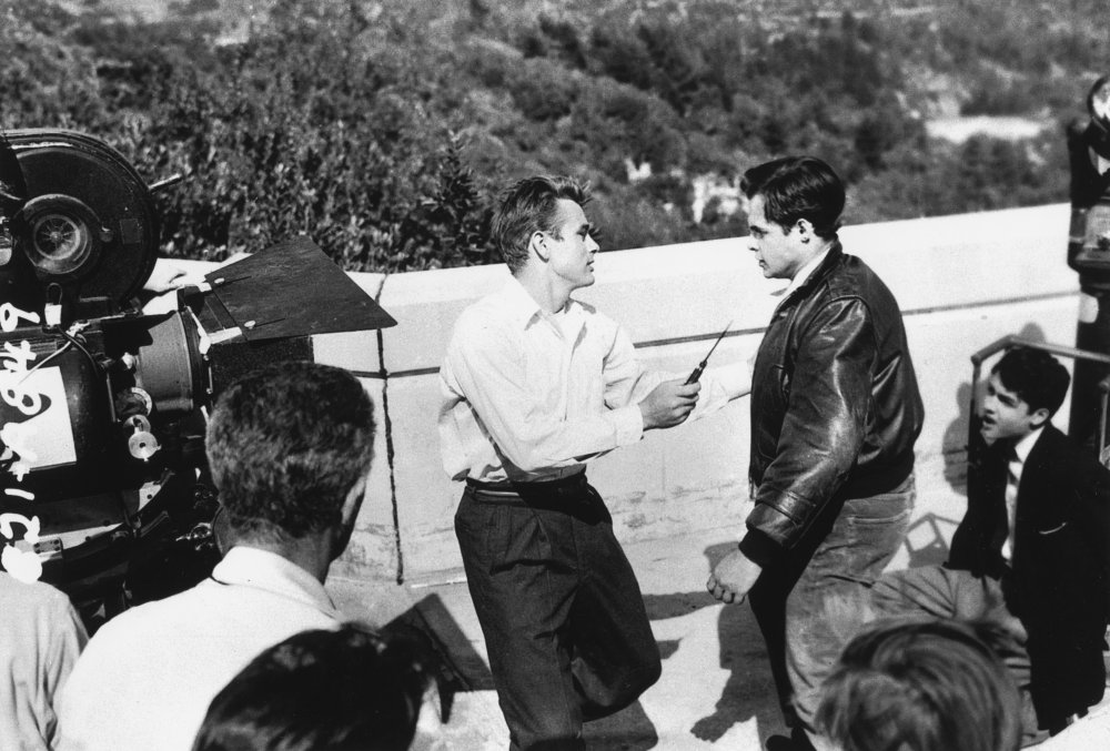 James Dean and Corey Allen (as troublemaker Buzz Gunderson) film the thrilling knife-fight scene on the terrace of the Griffith Observatory in Los Angeles