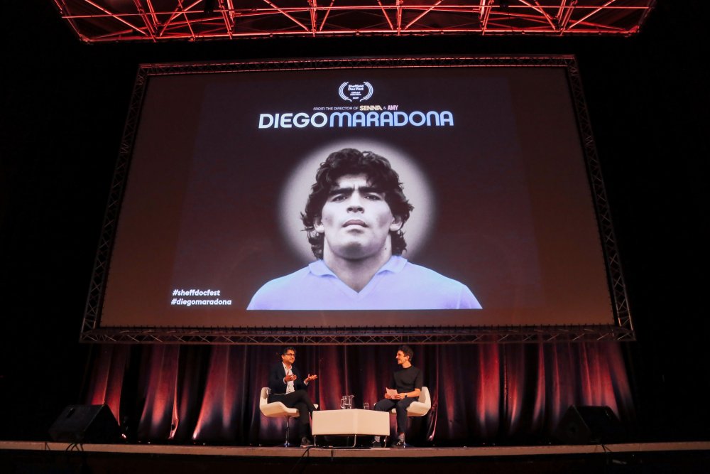 Diego Maradona director Asif Kapadia and Sheffield Doc/Fest head programmer Luke Moody on stage at the festival’s 2019 opening night