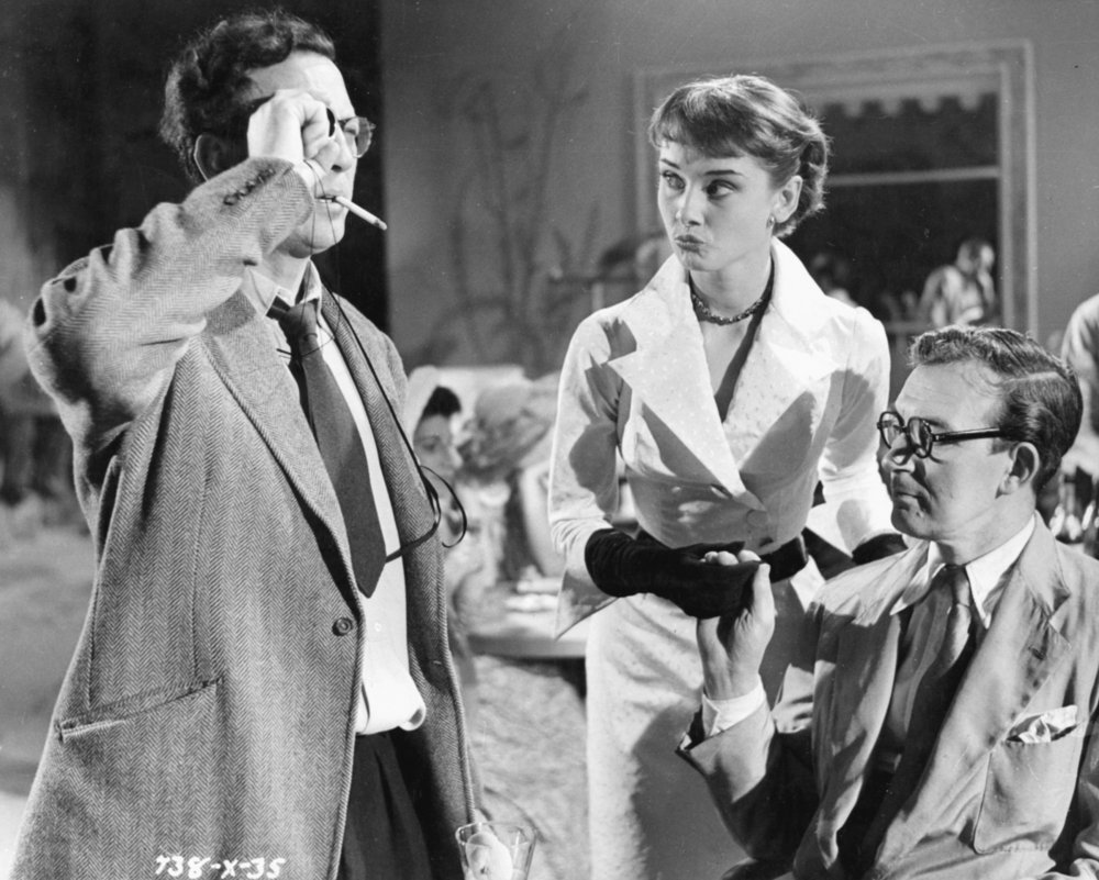Left to right: Slocombe, Audrey Hepburn and director Charles Crichton on the set of The Lavender Hill Mob (1951)