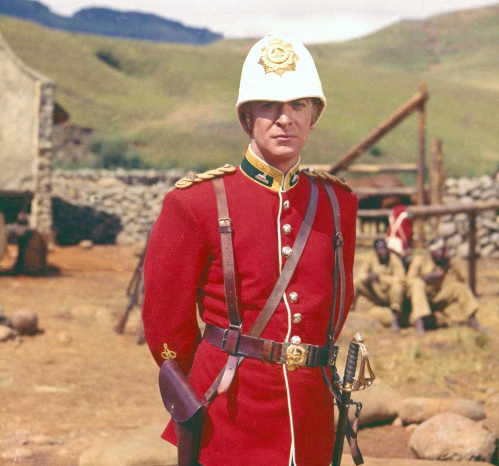 All dressed up for stardom: Caine poses in uniform for a portrait between takes. He quickly found himself one of the biggest actors in 1960 British cinema, after his star-making turn here playing infantry officer Lieutenant Gonville Bromhead. 